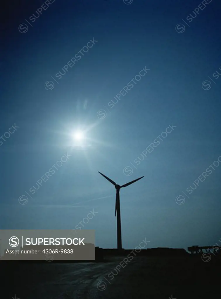 Silhouette of a wind power station.