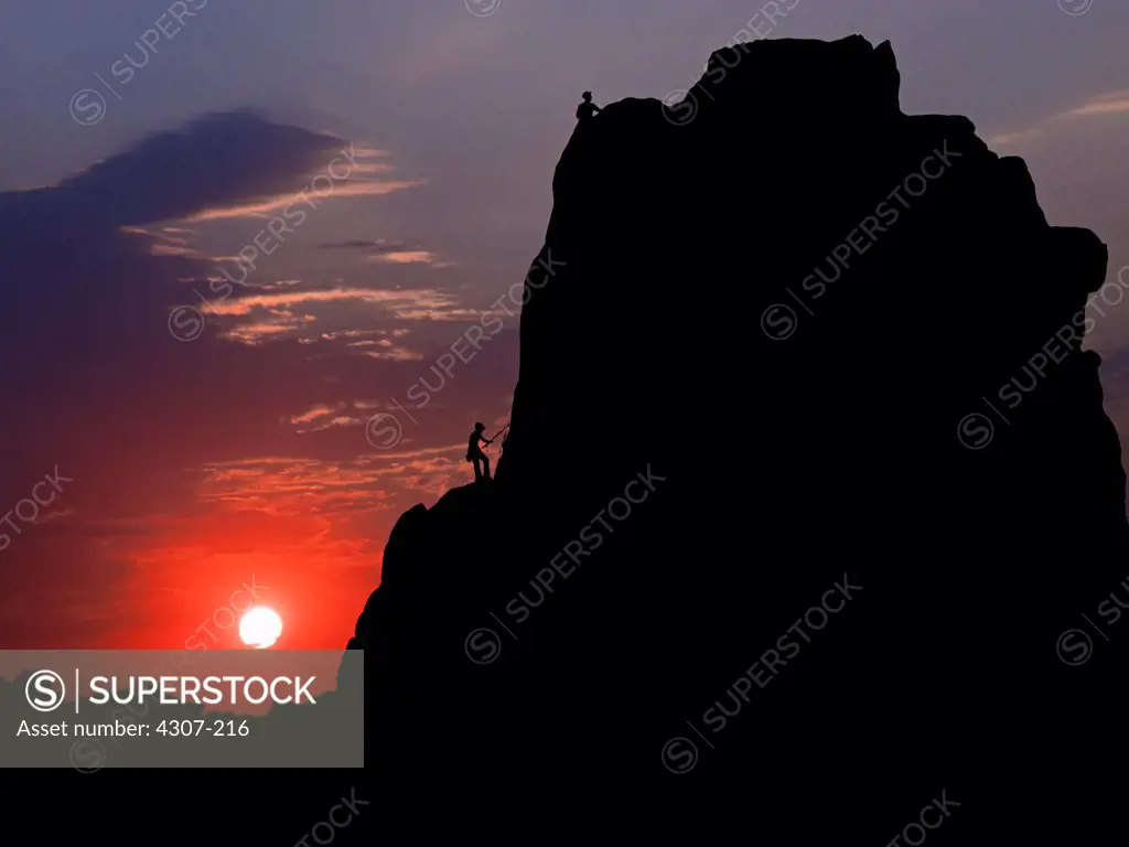 Rockclimbers Silhouetted by Sun