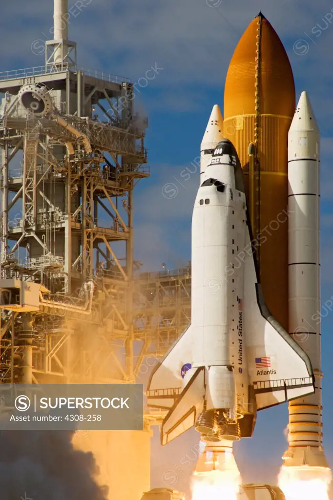 CAPE CANAVERAL, Fla. - With nearly 7 million pounds of thrust generated by twin solid rocket boosters and three main engines, space shuttle Atlantis races to orbit over Launch Pad 39A at NASA's Kennedy Space Center in Florida. Liftoff on its STS-129 mission came at 2:28 p.m. EST Nov. 16. Aboard are crew members Commander Charles O. Hobaugh; Pilot Barry E. Wilmore; and Mission Specialists Leland Melvin, Randy Bresnik, Mike Foreman and Robert L. Satcher Jr. On STS-129, the crew will deliver two Ex