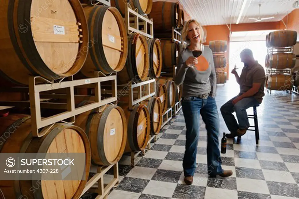 Tad and Sarah Fewel in their barrel room at their winery in the Rattlesnake Hills AVA in Washington state.