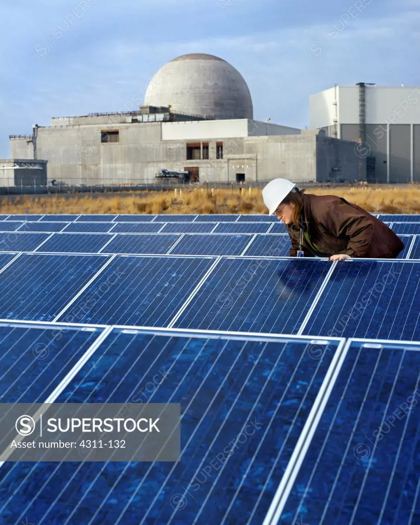 An Engineer Checks on the Status of Solar Panels