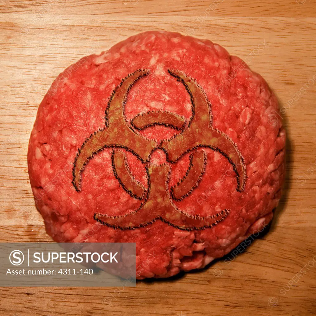 A Hamburger Patty with a Biohazard Symbol In It