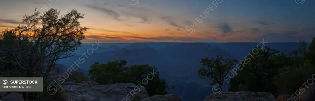 The Grand Canyon is seen after sunset bathed in twilight colors in this panorama taken from the South Rim, Arizona