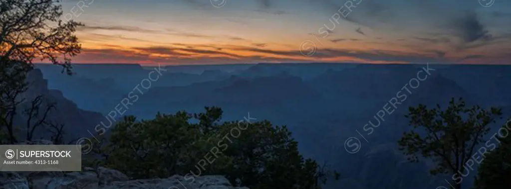 The Grand Canyon is seen after sunset bathed in twilight colors in this panorama taken from the South Rim, Arizona