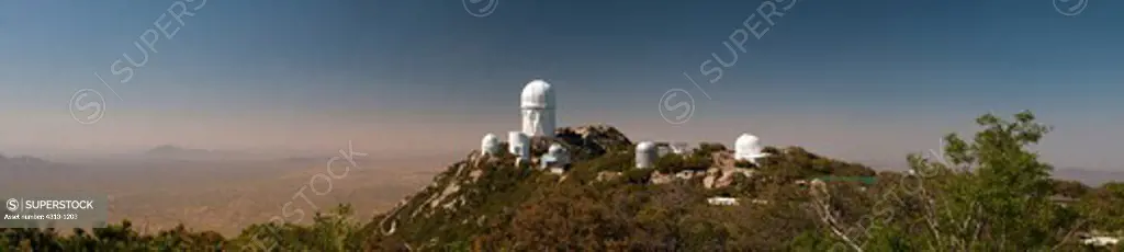 Kitt Peak National Observatory, Arizona, is seen in this panorama. The largest 4-meter Mayall telescope dome dominates the mountaintop.
