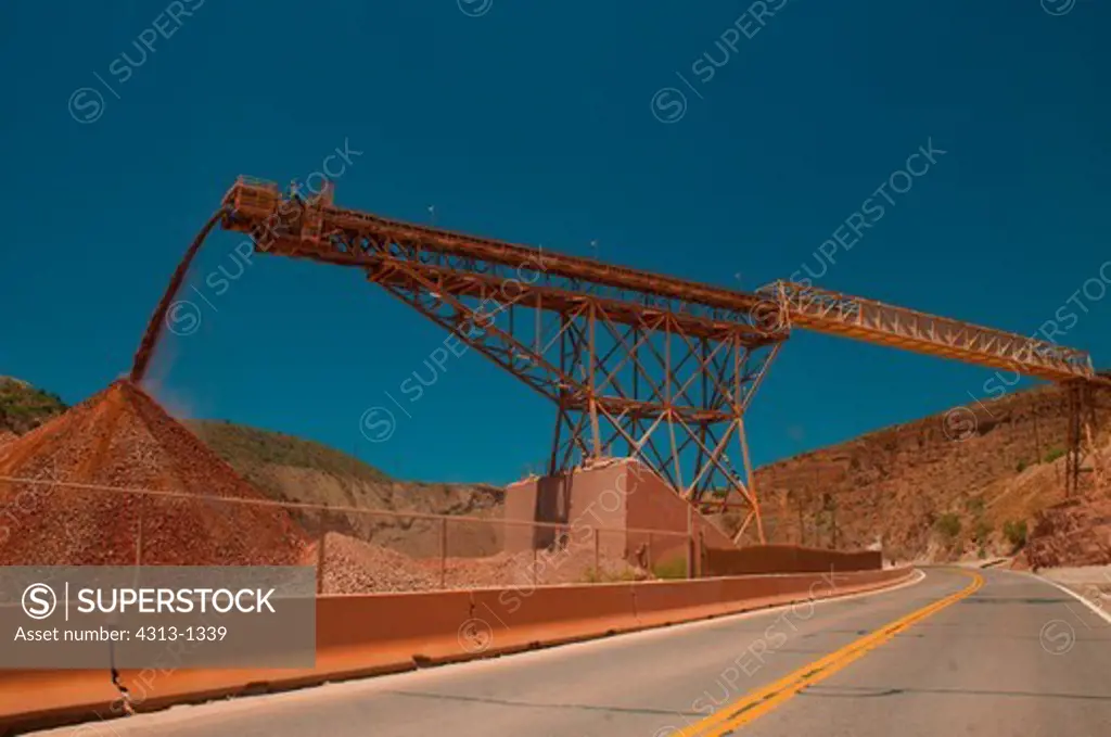 A conveyor belt drops rock at the Morenci Mine in Morenci, Arizona. It is the largest copper mine in North America and one of the largest in the world. It also mines gold.