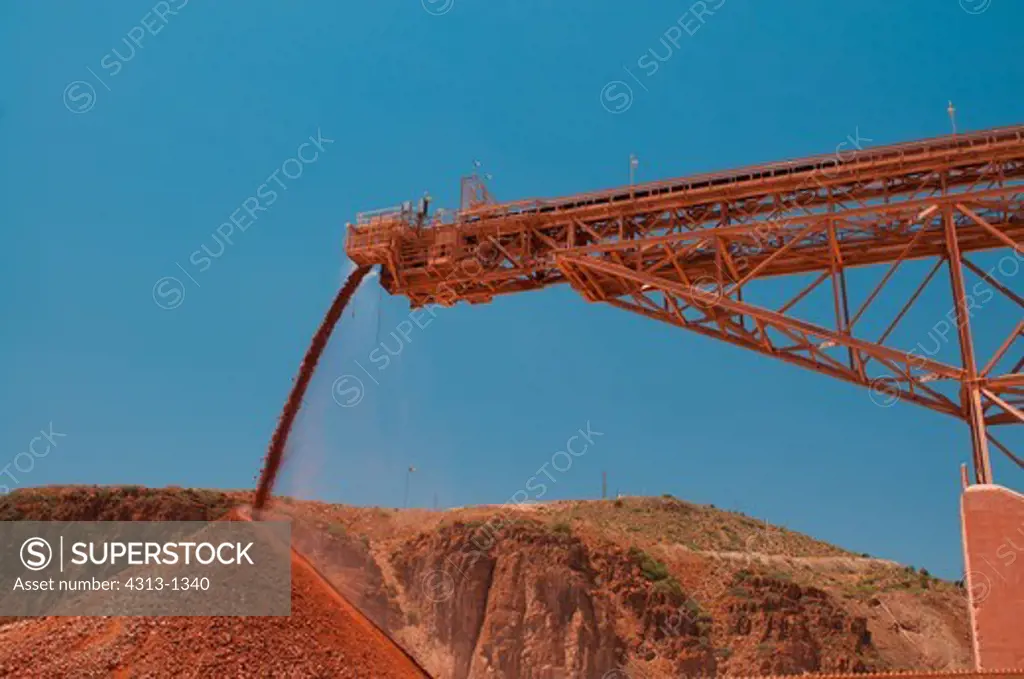 A conveyor belt drops rock at the Morenci Mine in Morenci, Arizona. It is the largest copper mine in North America and one of the largest in the world. It also mines gold.