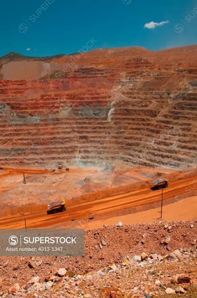 Haul trucks are seen hauling ore out of the open-pit Morenci Mine in Morenci, Arizona. It is the largest copper mine in North America and one of the largest in the world. It also mines gold.