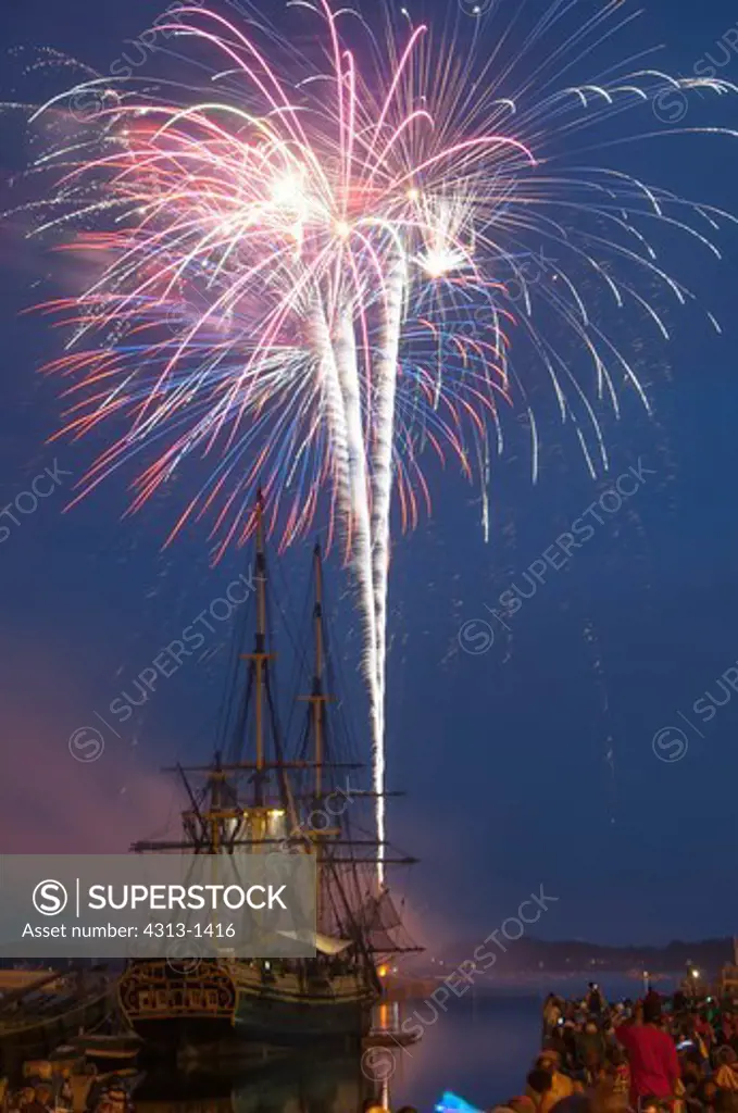USA, Massachusetts, Salem, Fireworks exploding over replica tall-mast ship