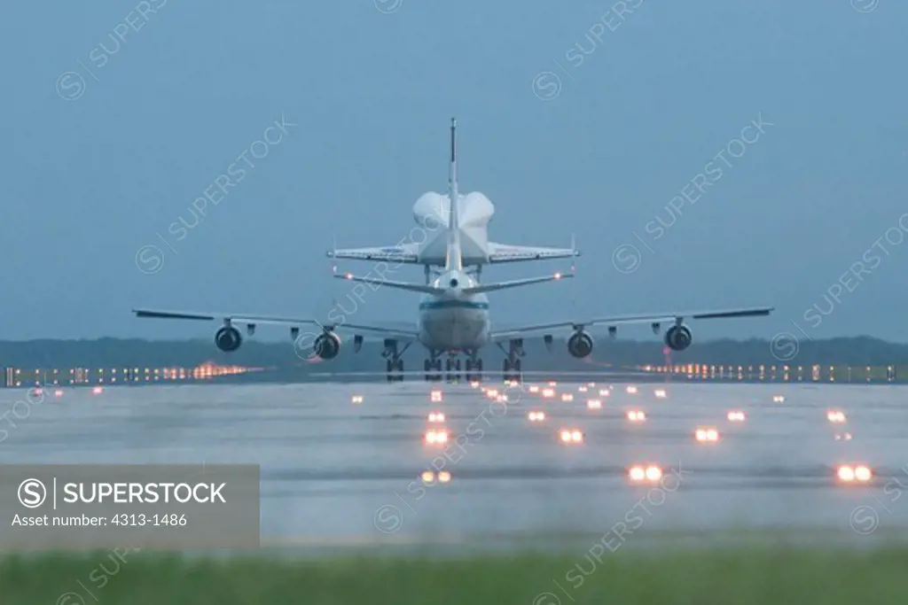 USA, Florida, Cape canaveral, Kennedy Space Center, Rear View of Endeavour space shuttle lifting on top of 747 shuttle carrier aircraft