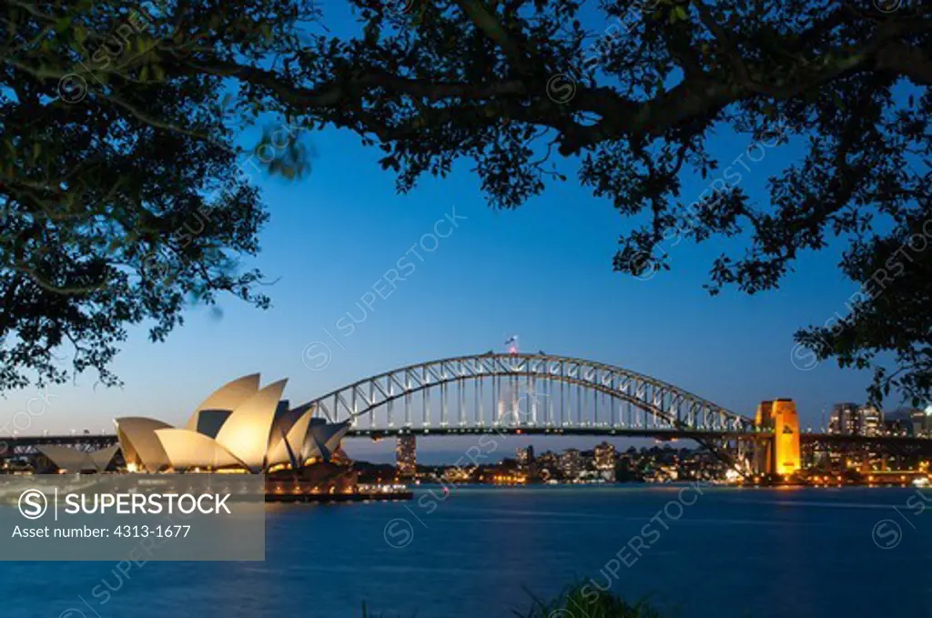 Australia, New South Wales, Sydney. View of Opera House and Sydney Harbor Bridge at twilight