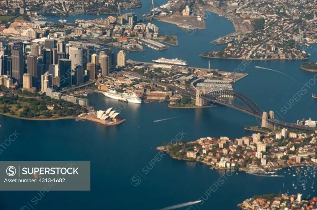 Australia, New South Wales, Aerial view of Sydney Harbor, Sydney Opera house at left and Harbor Bridge at right