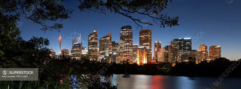 Australia, New South Wales, Sydney. Skyline of city at twilight with Sydney tower at left