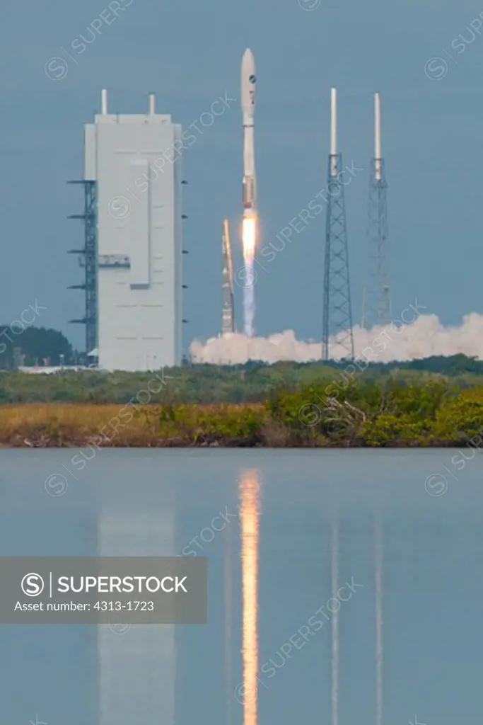 USA, Florida, Cape Canaveral, view of space rocket taking off. A United Launch Alliance (ULA) Atlas V (Atlas 5) rocket launches the X-37B Orbital Test Vehicle (OTV) unmanned space plane on its third mission on December 11, 2012.