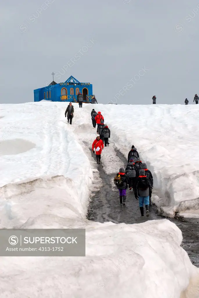 Tourists walking towards a church, Frei Chi-Base, King George Island, South Shetland Islands, Antarctic Peninsula, Antarctica
