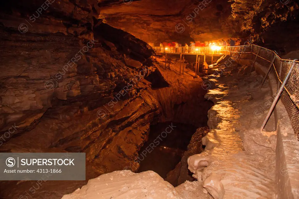 Hikers with lanterns in the River Styx section of Mammoth Cave National Park, Kentucky, USA