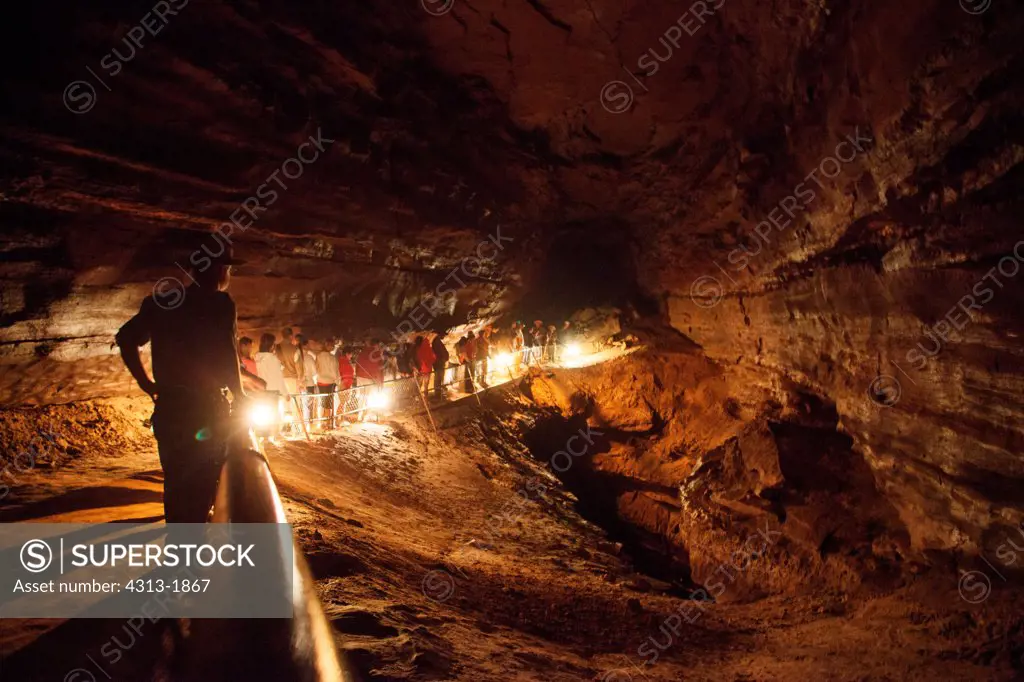 Hikers with lanterns in the River Styx section of Mammoth Cave National Park, Kentucky, USA