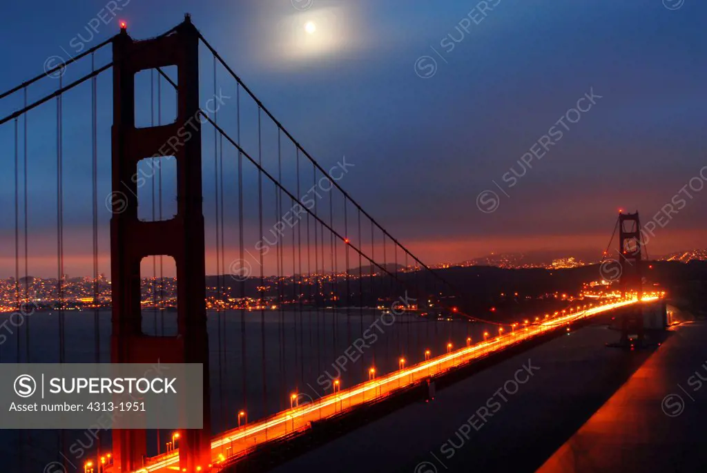 Moon over the Golden Gate Bridge at dusk, San Francisco Bay, San Francisco, California, USA