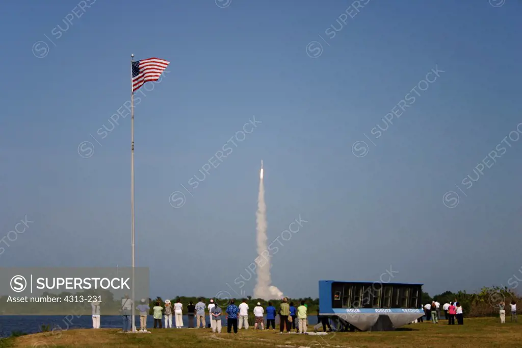 Spectators watch an Atlas V rocket launching the ASTRA 1KR communications satellite.