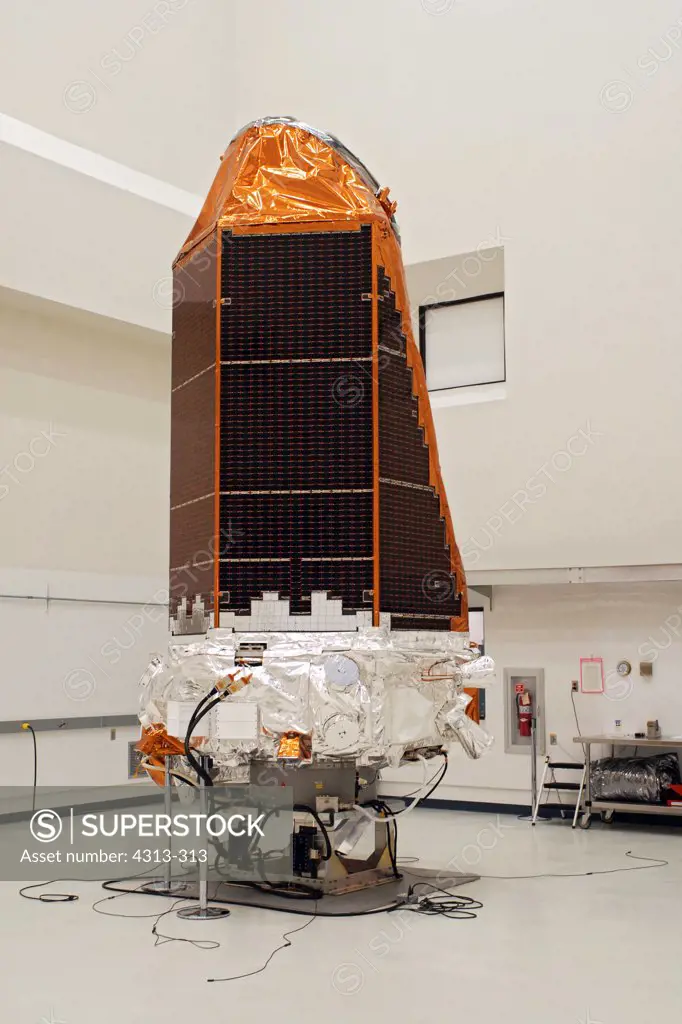 NASA's Kepler space telescope, the first capable of finding Earth-like planets, is prepared for launch inside a cleanroom near Kennedy Space Center.