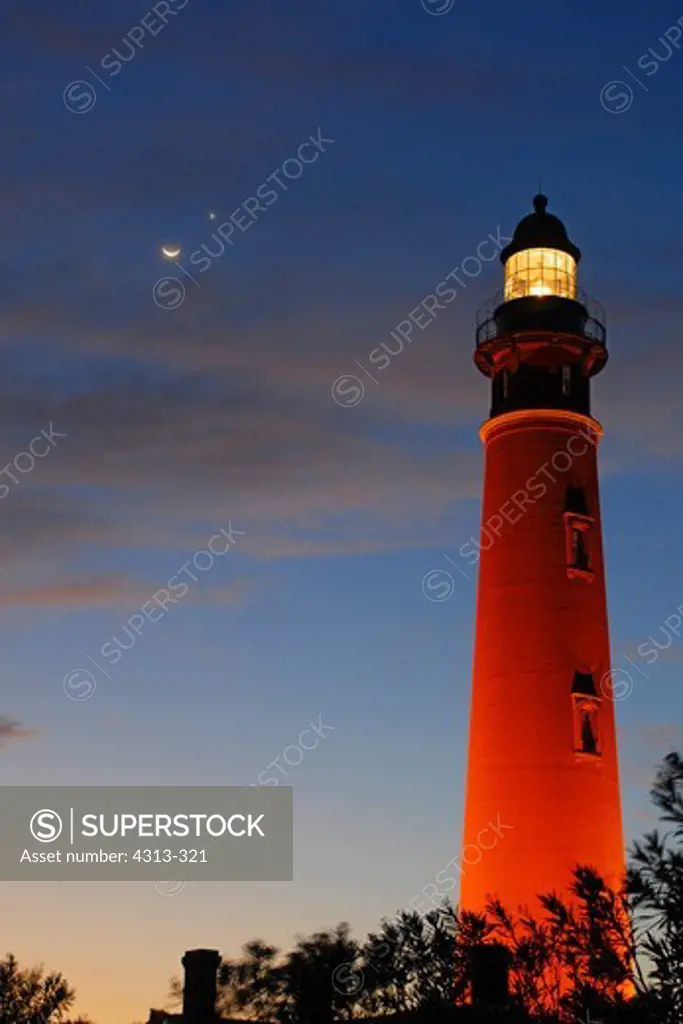 The Moon and Venus meet over the Ponce de Leon Inlet Lighthouse shortly after sunset