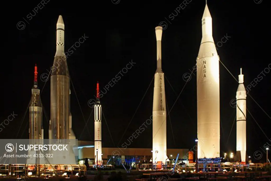 The Rocket Garden at the Kennedy Space Center Visitor Complex at night. On display are (l-r) a Mercury Atlas, Atlas Agena, Mercury Redstone, Delta, Juno II, and Juno I.