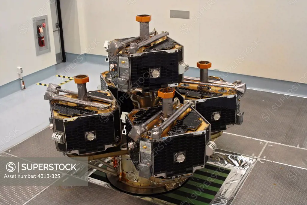 NASA's Time History of Events and Macroscale Interactions during Substorms, or THEMIS, spacecraft, consisting of five identical cube-shaped satellites, is prepared for launch on a spin-table in a cleanroom near Kennedy Space Center.