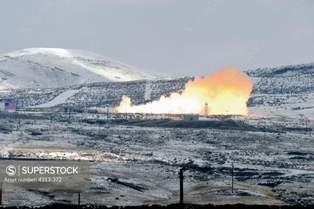 The final space shuttle solid rocket booster test is conducted at the ATK test site near Promontory, Utah, on a foggy and snow-covered morning in February, 2010.