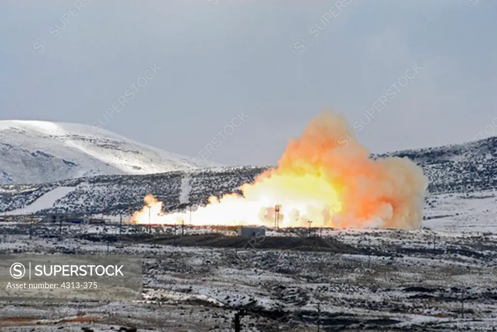 The final space shuttle solid rocket booster test is conducted at the ATK test site near Promontory, Utah, on a foggy and snow-covered morning in February, 2010.