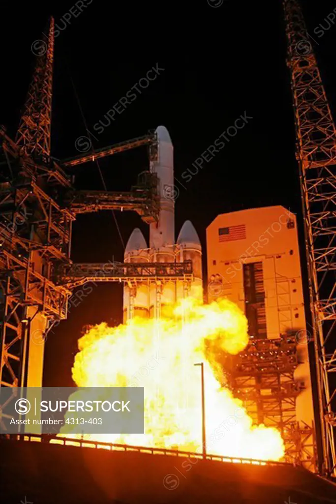 A Delta IV-Heavy rocket roars off Pad 37B at Cape Canaveral with a torrent of fire. Onboard is the NRO L-32 spy satellite, hoisted into orbit for the National Reconnaissance Office.