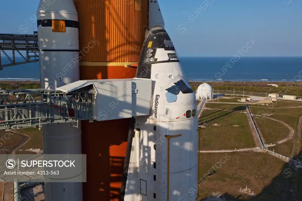 Shuttle Endeavour is on the launch pad in the late afternoon, preparing for STS-134, the next to last shuttle mission.