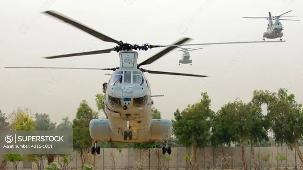 US Marine Corps CH-46 Sea Knights Make a Fast Approach Toward an Undisclosed Landing Zone in Baghdad, Iraq