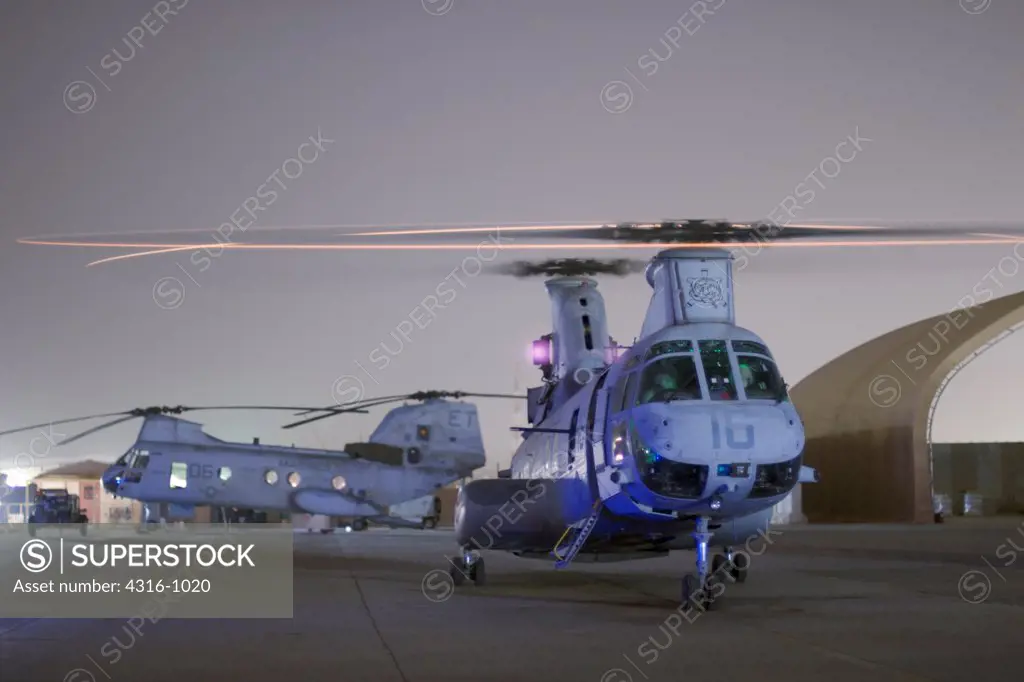A US Marine Corps CH-46 Sea Knight Prepares to Launch for a Night Mission from Al Taqaddum Air Base in Al Anbar Province of Iraq