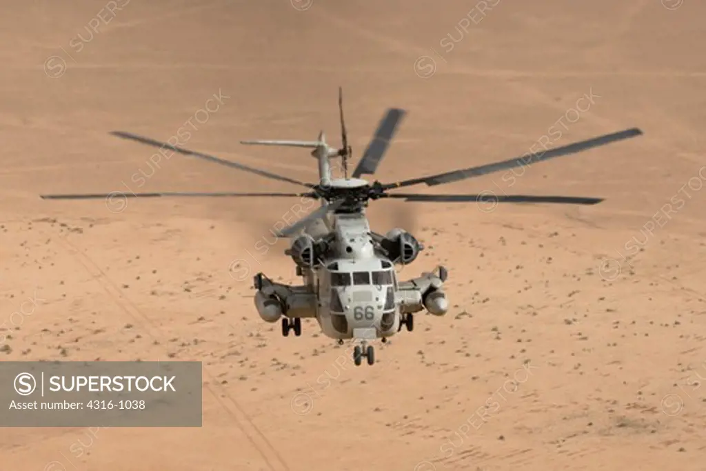 A US Marine CH-53D Sea Stallion Helicopter Plies the Air Above the Desert of the Al Anbar Province of Iraq