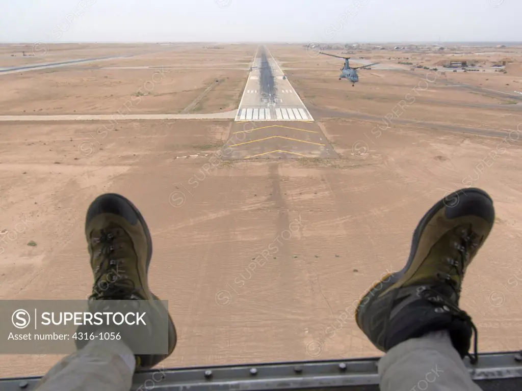 View Out of The Rear of a US Marine Corps CH-46 Sea Knight Helicopter of an Air Strip at Al Taqaddum Air Base in Iraq's Al Anbar Province