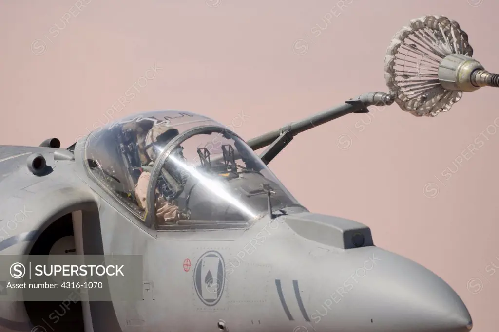 A US Marine Aviator Carefully Maneuvers His AV-8B Harrier Into Position to Refuel His Craft High Over the Al Anbar Province of Iraq