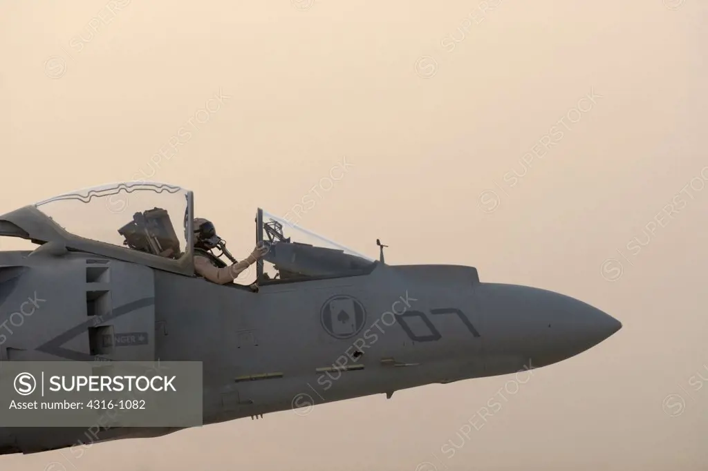 A US Marine Corps Aviator Prepares to Launch his AV-8B Harrier from Al Asad Air Base in the Al Anbar Province of Iraq
