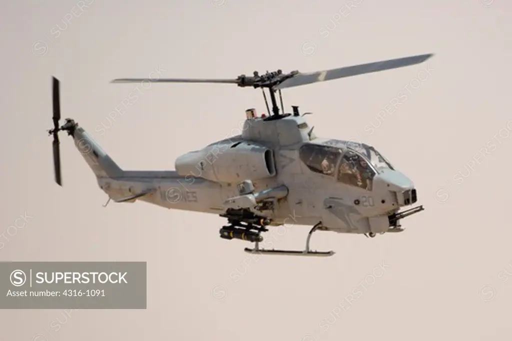 US Marine Corps AH-1W Super Cobra Makes an Attack Run