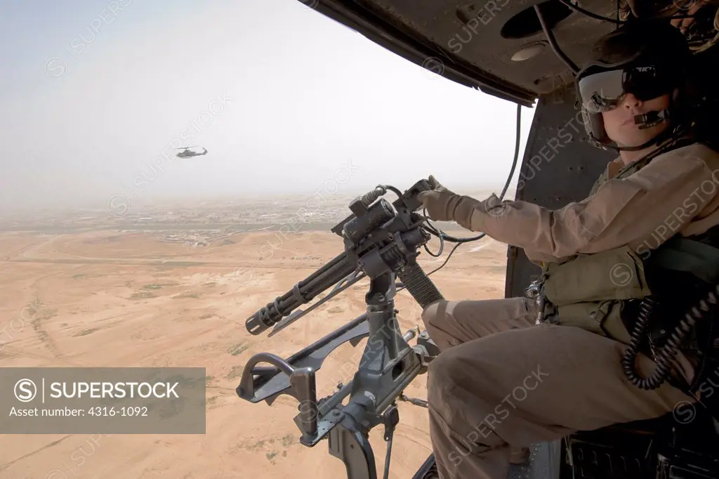 US Marine Mans a High Speed Rotary Gun During a Close Air Support Mission Over Iraq's Al Anbar Province