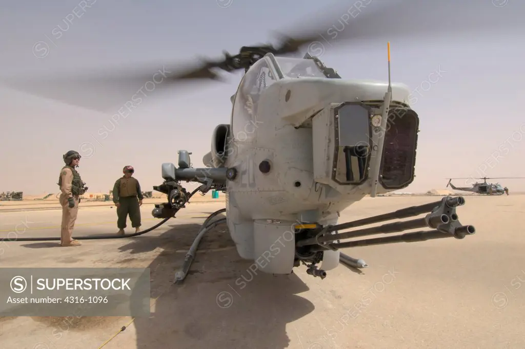 View of a US Marine Corps AH-1W Super Cobra While It Refuels at Al Asad Air Base in the Al Anbar Province of Iraq