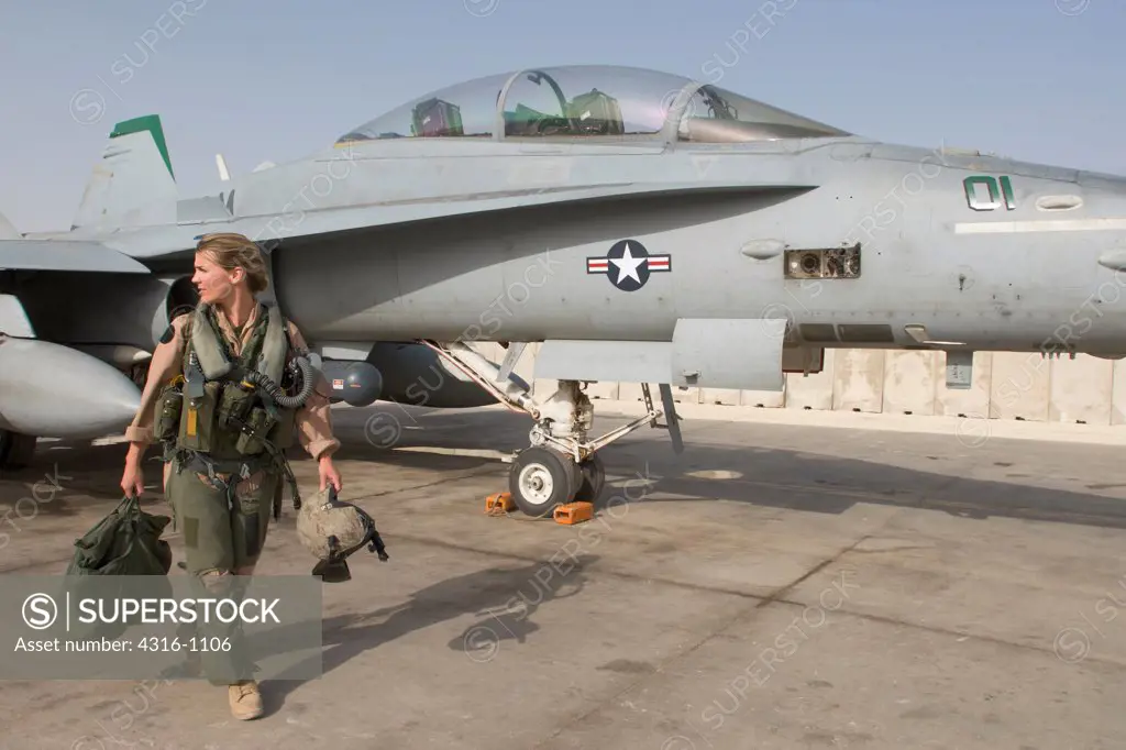 A US Marine Corps Aviator Walks to Her F/A-18D Hornet at Al Asad Air Base in the Al Anbar Province of Iraq to Begin a Close Air Support Mission