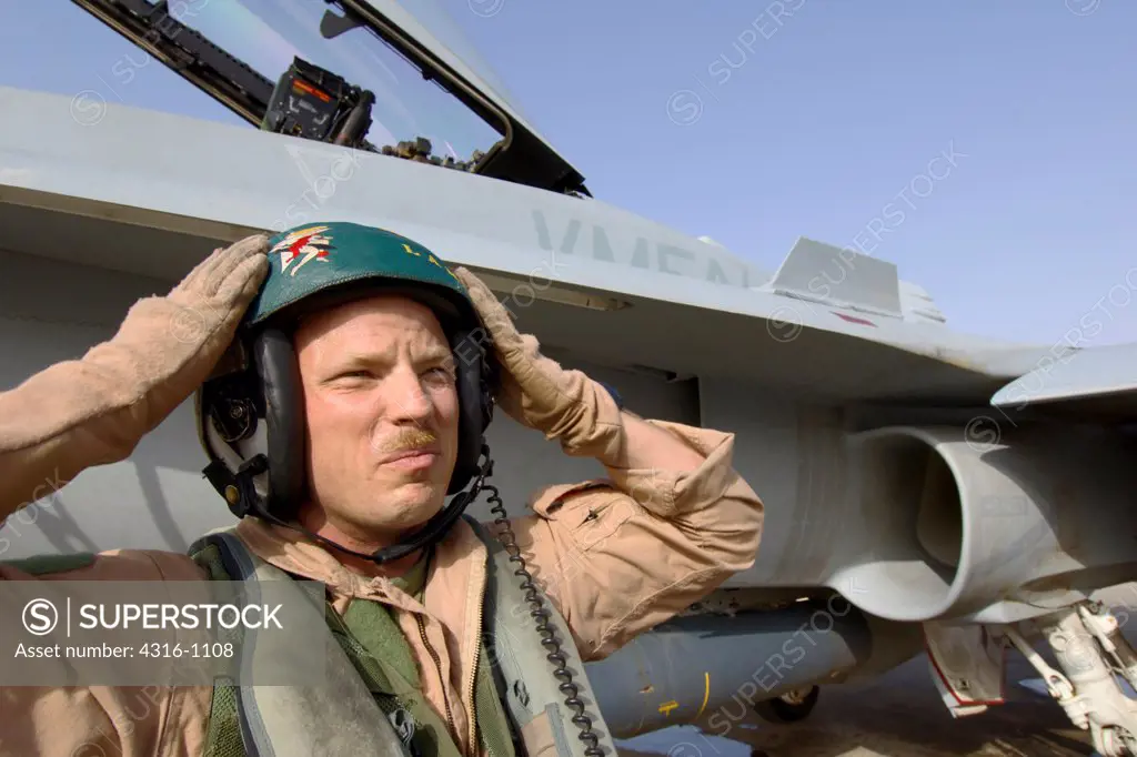 A US Marine Corps Aviator Prepares to Embark on a Close Air Support Mission in His F/A-18D Hornet From Al Asad Air Base in the Al Anbar Province of Iraq