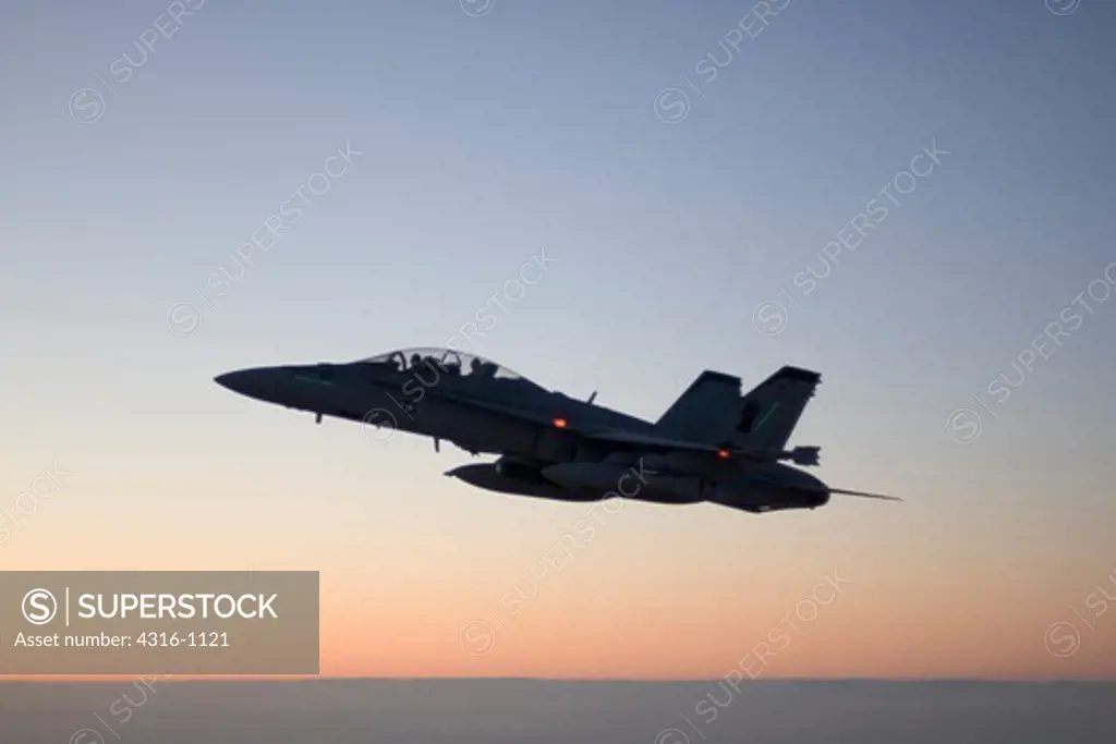 Air to Air View of A US Marine Corps F/A-18D Hornet Miles Above the Al Anbar Province of Iraq at Sunset During a Close Air Support Mission