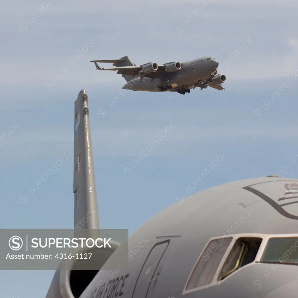 A C-17 Globemaster Flies Above a KC-135 Aerial Refueling Tanker