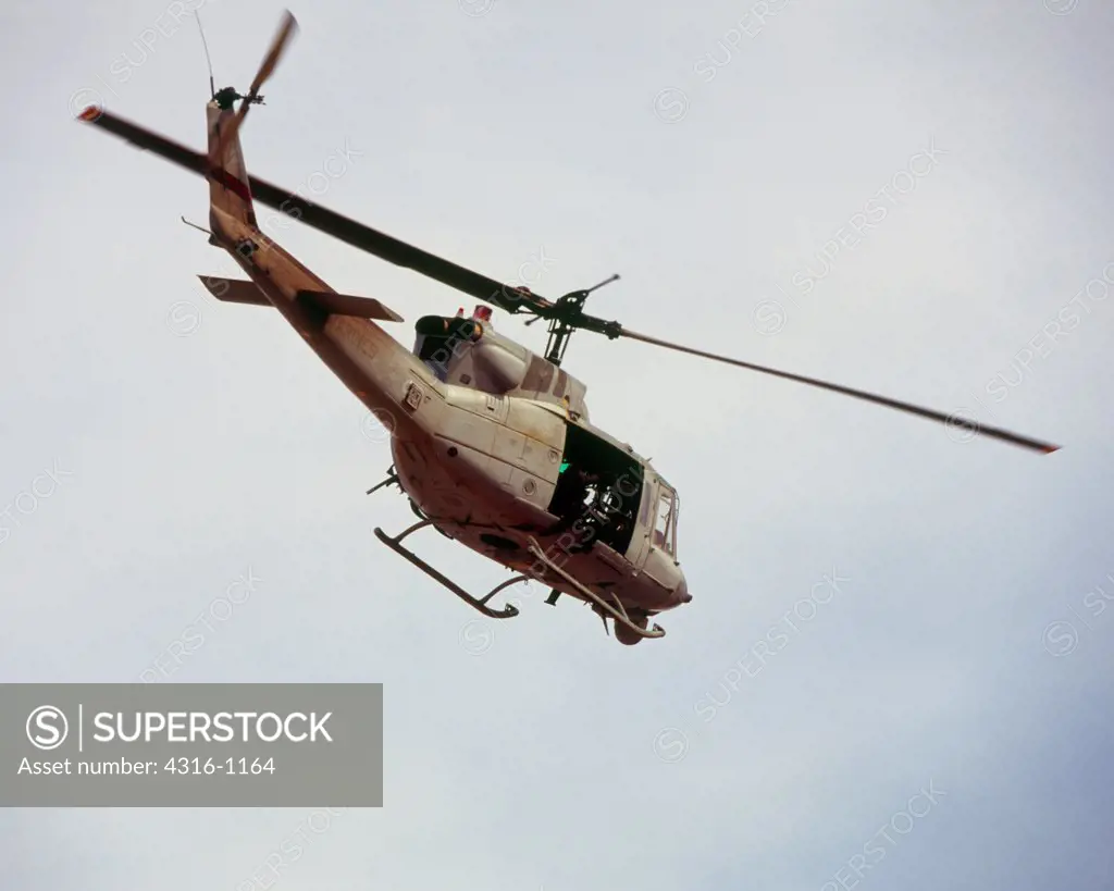 US Marine Corps UH-1N 'Huey' Flies A Close Air Support Mission Over Barwana, Iraq