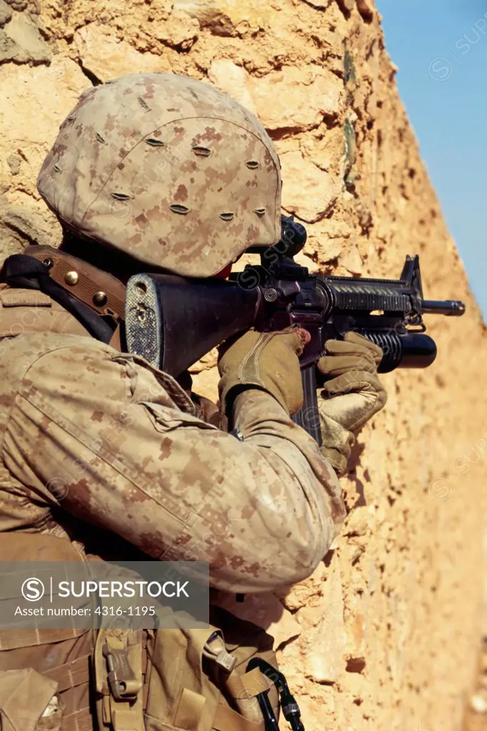 A US Marine Scans the Distance With the Scope of His M-16 During a Combat Operation in the City of Haditha, in Iraq's Anbar Province