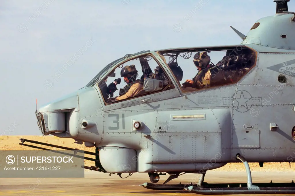 US Marine Aviators Prepare to Launch An AH-1W Super Cobra from Al Asad Air Base in Iraq's Anbar Province