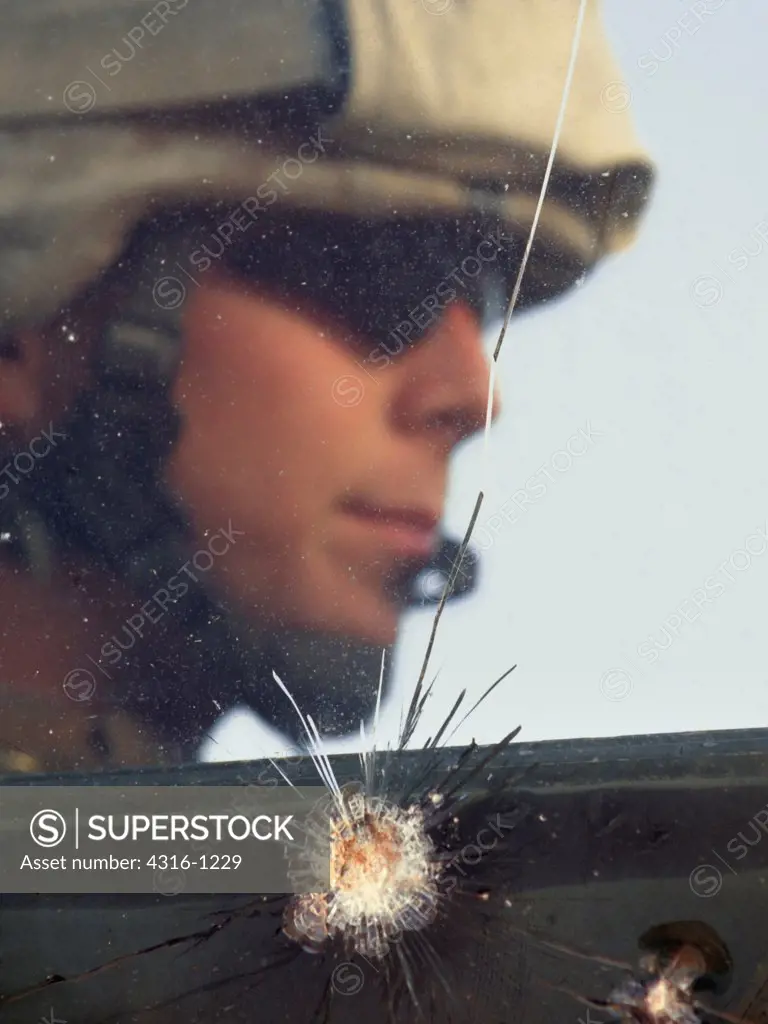 A US Marine Sits Behind Bullet Proof Glass That Was Recently Tested By a Machine Gun Round, Barwana, Iraq