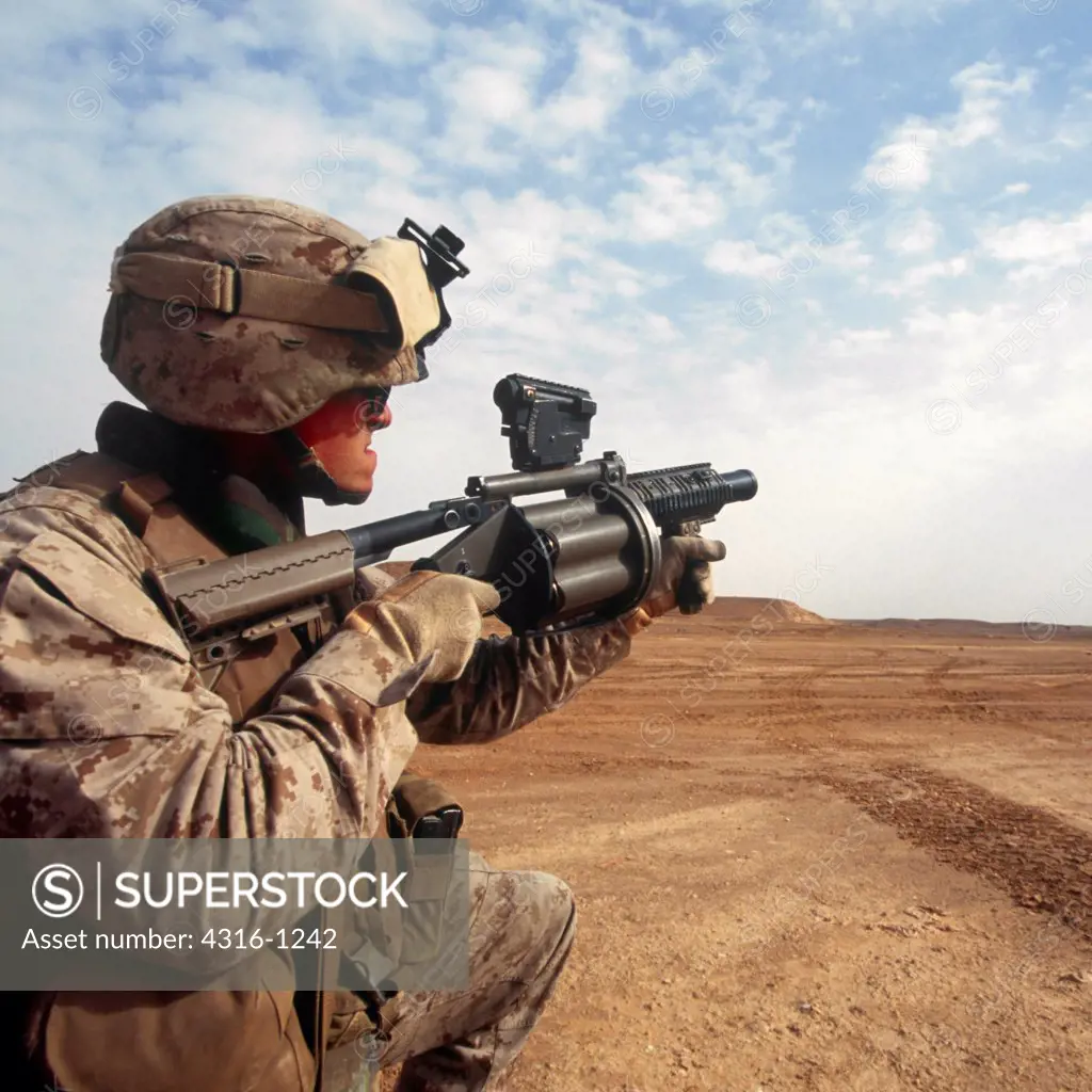 A US Marine Fires an M-32 Semiautomatic Grenade Launcher
