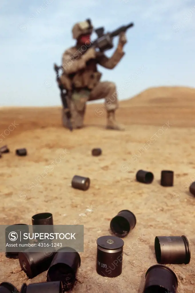 A US Marine Fires an M-32 Semiautomatic Grenade Launcher